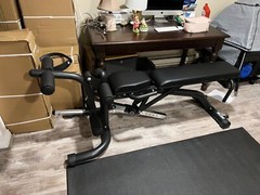Body Solid Leverage Gym still in boxes. Also is 260 lbs Rogue Bumper Plate set.