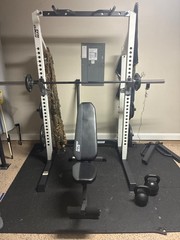 Squat rack with 255 lbs of plates, 45lbs barbell, bench,pull up bar, 35+50lbs kb